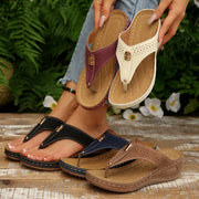 Sandals and Slippers collection featuring toe-post wedge sandals