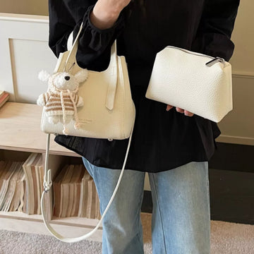 Chic Textured Leather Crossbody Bag with Adorable Charm